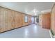 Open concept living room with wood paneling and neutral paint at 109 Winston Way, Goose Creek, SC 29445