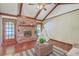 Living room boasts hardwood floors, a brick fireplace, exposed beams, and a play area at 109 Winston Way, Goose Creek, SC 29445