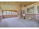 Spacious sunroom with brick accents, wood ceiling, and many windows at 109 Winston Way, Goose Creek, SC 29445