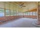 Spacious sunroom with brick accents, wood ceiling, and many windows at 109 Winston Way, Goose Creek, SC 29445