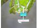 Overhead view showcasing an island with a gazebo, dock, and a fire pit surrounded by green vegetation at 111 Tidewater Way, Charleston, SC 29492
