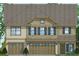 Exterior elevation showcases a charming two-story home with neutral color scheme and well-placed windows at 115 Seaton St, Summerville, SC 29486