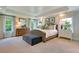 Bright primary bedroom with decorative pillows, neutral furniture, with lots of natural light from windows at 115 Seaton St, Summerville, SC 29486
