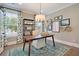 Office features decor, decorative rug, and natural light from the window, located off entryway at 115 Seaton St, Summerville, SC 29486