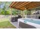 Backyard featuring a covered outdoor kitchen and a jacuzzi tub at 1167 Mossy Rock Dr, Summerville, SC 29485
