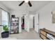 Bright bedroom with a ceiling fan, two closets, and exterior view, features a bookshelf at 1167 Mossy Rock Dr, Summerville, SC 29485