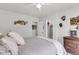 Bedroom features a ceiling fan, walk-in closet, ensuite access, and a decorative wall hangings at 1167 Mossy Rock Dr, Summerville, SC 29485