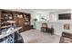 Upstairs bonus room showcasing built-in shelving, musical instruments, decor, and a cozy nook at 1167 Mossy Rock Dr, Summerville, SC 29485
