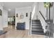 Inviting foyer with hardwood floors, staircase, and stylish decor at 1167 Mossy Rock Dr, Summerville, SC 29485