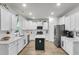 Spacious kitchen with white cabinets, stainless steel appliances, and a center island with a butcher block countertop at 1167 Mossy Rock Dr, Summerville, SC 29485