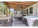 Covered outdoor space featuring a full kitchen, screened-in porch, and jacuzzi tub at 1167 Mossy Rock Dr, Summerville, SC 29485