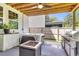 Covered outdoor space featuring a fire pit, full kitchen, and a jacuzzi tub at 1167 Mossy Rock Dr, Summerville, SC 29485