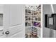 Walk-in pantry featuring shelves stocked with various food items and storage containers at 1167 Mossy Rock Dr, Summerville, SC 29485