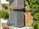 Aerial view shows the home's backyard deck, well-maintained lawn, and solar panels on the roof at 1218 Cosmos Rd, Summerville, SC 29483