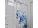 Shower with floral patterned curtain, white tile and shower head at 1218 Cosmos Rd, Summerville, SC 29483