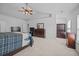 Spacious main bedroom with neutral carpet, ceiling fan, and lots of closet space at 1218 Cosmos Rd, Summerville, SC 29483