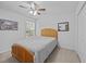 Cozy bedroom with neutral carpet, ceiling fan, window and wood-frame bed at 1218 Cosmos Rd, Summerville, SC 29483