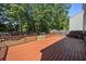 Large stained wooden deck with railing and backyard views at 1218 Cosmos Rd, Summerville, SC 29483