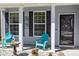 Cozy front porch featuring comfortable seating, decorative accents, and a welcoming entrance at 1218 Cosmos Rd, Summerville, SC 29483