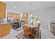 Open-concept kitchen and dining area with wood cabinets and stainless steel appliances at 1218 Cosmos Rd, Summerville, SC 29483