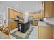 Well-lit kitchen features stainless appliances, an island, and plenty of cabinets at 1218 Cosmos Rd, Summerville, SC 29483