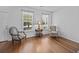 Bright and airy living area features hardwood floors, neutral paint, and comfortable seating at 1218 Cosmos Rd, Summerville, SC 29483