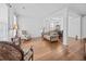 Spacious living room featuring hardwood floors, decorative columns, ample natural light and comfortable seating at 1218 Cosmos Rd, Summerville, SC 29483