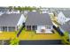 Aerial view of the backyard with patio, dining set, and surrounding neighborhood at 127 Archdale St, Summerville, SC 29486