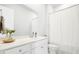 Modern bathroom features a vanity with sink and storage plus shower with curtain at 127 Archdale St, Summerville, SC 29486