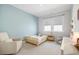 Cozy bedroom featuring a twin bed and a cream-colored chair at 127 Archdale St, Summerville, SC 29486