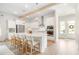 Bright and airy kitchen with an island, stainless steel appliances, and a breakfast bar at 127 Archdale St, Summerville, SC 29486