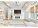 Open living room with fireplace, large screen TV and view of the entry and stairway at 127 Archdale St, Summerville, SC 29486