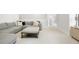 Upstairs living room features a comfortable gray couch and padded ottoman at 127 Archdale St, Summerville, SC 29486