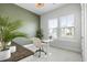 Inviting home office with a sit stand desk, two windows, and view of the community at 127 Archdale St, Summerville, SC 29486