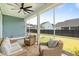 Screened in porch with seating area provides a relaxing outdoor space at 127 Archdale St, Summerville, SC 29486
