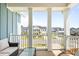 Outdoor porch with seating area provides a lovely view of the neighborhood at 127 Archdale St, Summerville, SC 29486