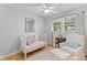 Inviting Bedroom with hardwood floors, a white crib, chair and lots of sunlight at 1303 Teal Ave, Charleston, SC 29412