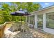 Backyard deck with outdoor dining area under a sun umbrella at 1303 Teal Ave, Charleston, SC 29412