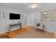 Charming living room showcasing hardwood floors, neutral accents, modern entertainment setup at 1303 Teal Ave, Charleston, SC 29412