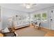 Bright living room with hardwood floors, fresh paint, neutral furnishings and window views at 1303 Teal Ave, Charleston, SC 29412