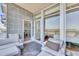 Private balcony with seating area and views into the bedroom and beyond at 136 Cooper River Dr, Mount Pleasant, SC 29464