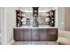 Elegant bathroom featuring a double vanity with marble countertop and dark wood cabinetry and shelving at 136 Cooper River Dr, Mount Pleasant, SC 29464