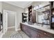 Well lit bathroom with double vanity, dark wood cabinetry, and decorative rug at 136 Cooper River Dr, Mount Pleasant, SC 29464