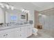Bright bathroom with double vanity, updated fixtures, and a glass enclosed shower at 136 Cooper River Dr, Mount Pleasant, SC 29464