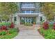 Inviting building entrance with manicured landscaping and planters at 136 Cooper River Dr, Mount Pleasant, SC 29464