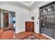 Elegant elevator entrance featuring a wooden cabinet, tile flooring, and stylish interior design elements at 136 Cooper River Dr, Mount Pleasant, SC 29464