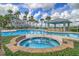 Relaxing hot tub adjacent to the pool and cabana, offering a luxurious experience in a beautifully landscaped setting at 136 Cooper River Dr, Mount Pleasant, SC 29464