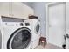 Laundry room features modern washer and dryer, storage cabinets, and functional layout at 136 Cooper River Dr, Mount Pleasant, SC 29464