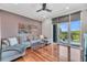Stylish living room with a comfortable sectional sofa, hardwood floors, and balcony access with great views at 136 Cooper River Dr, Mount Pleasant, SC 29464