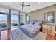 Bright bedroom with floor to ceiling windows, balcony access, and a ceiling fan at 136 Cooper River Dr, Mount Pleasant, SC 29464